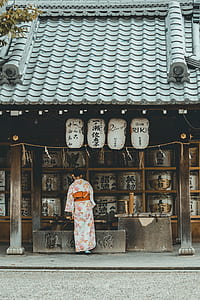 woman standing in front of house thumbnail