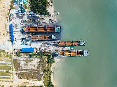 boats on water near green trees during daytime thumbnail
