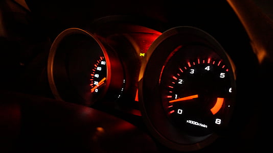 selective focus photography of vehicle analog speedometer control panel thumbnail