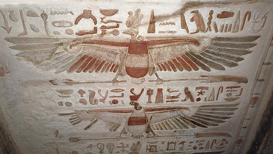brown and white poster on wall thumbnail