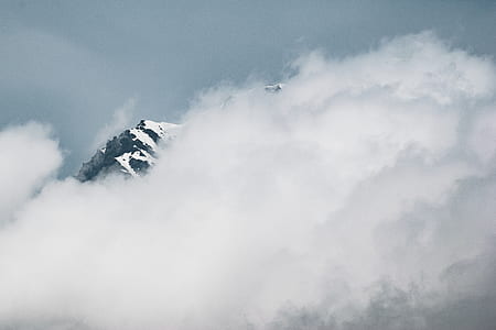 white clouds covering mountain during daytime thumbnail