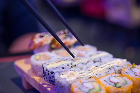 person taking sushi thumbnail