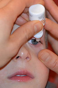 person dropping drop bottle on boy's eyes thumbnail