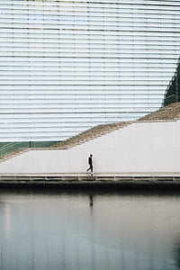 man walking along the street thumbnail