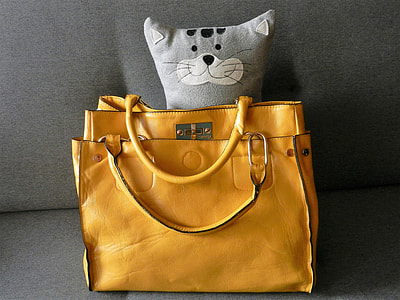 two brown leather handbags on gray surface thumbnail