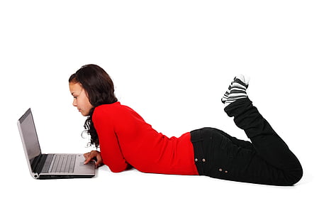 woman laying in front of laptop computer thumbnail