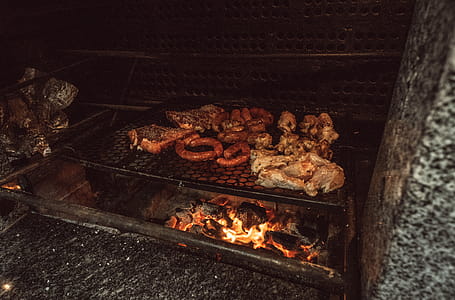 Grilled Meat on Black Charcoal Grill at Nighttime thumbnail