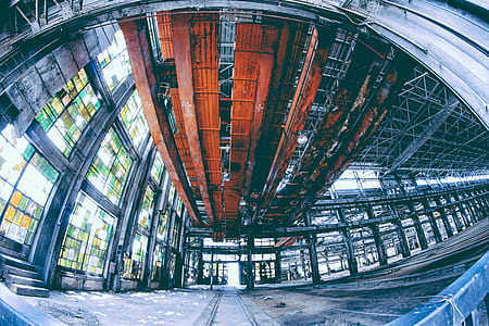 fish-eye architectural photography of orange metal overhead crane thumbnail