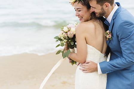 Man Hugging Woman Near Seashore thumbnail