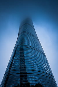 low-angle photography of twisted glass high-rise building thumbnail