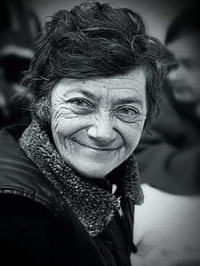 grayscale photo of woman taking selfie thumbnail