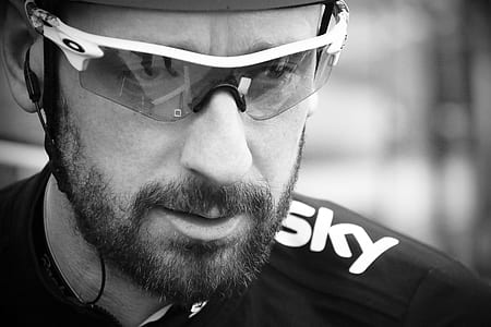 grayscale photo of man wearing sports sunglasses thumbnail