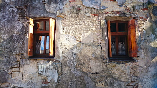 opened brown wooden windows of gray building thumbnail
