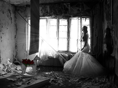 woman in white dress inside dark messy room thumbnail