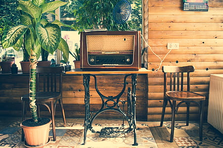 brown transistor radio on brown and black table thumbnail