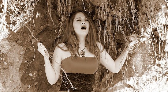 woman standing in front of stone thumbnail
