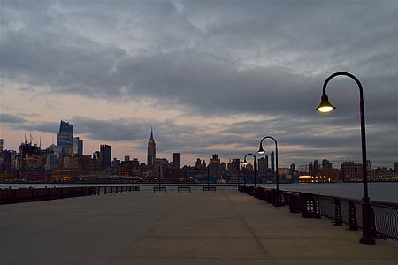 black steel post lamp near building thumbnail