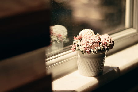 Pink and White Flowers in White Vase Centerpiece on White Window thumbnail