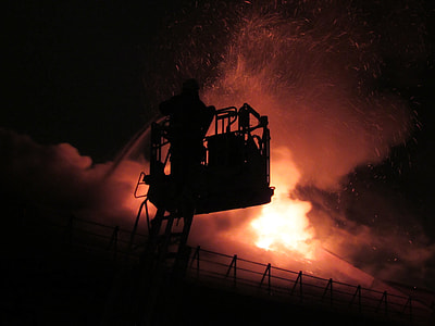 silhouette of firefighter fighting fire thumbnail