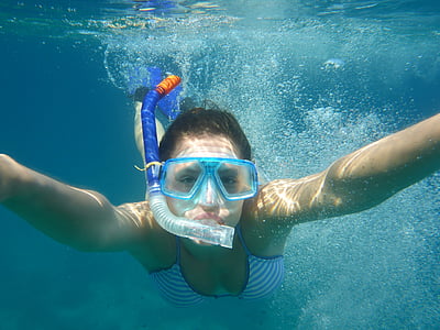 woman swimming underwater thumbnail