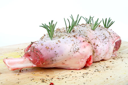chicken drumstick on brown wooden board thumbnail