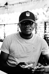 Monochrome Photo of Man Wearing Cap thumbnail