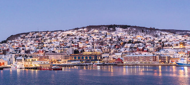 landscape photography of assorted-color building near body of water thumbnail
