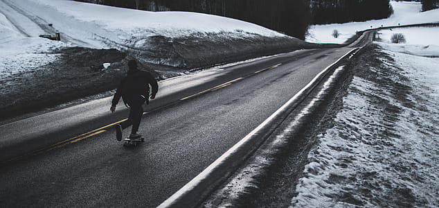 Grayscale Photo of Man Walking on Road thumbnail