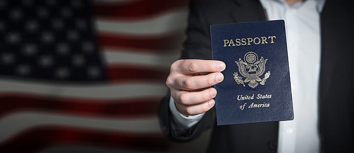 person holding passport of United States of America thumbnail