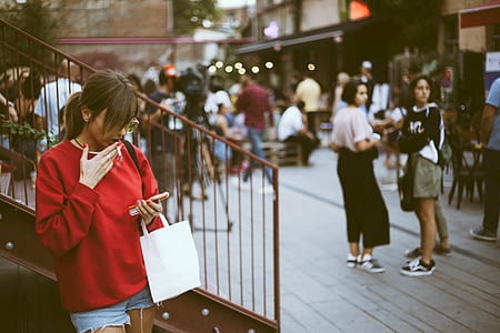woman holding paper bag thumbnail