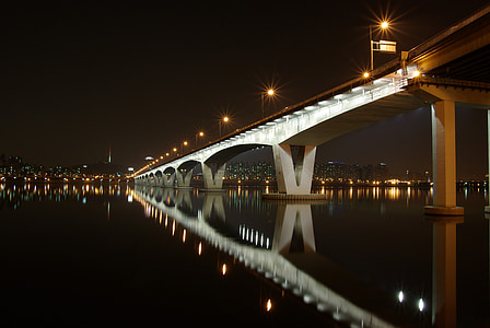 photo of white bridge during nighttime thumbnail