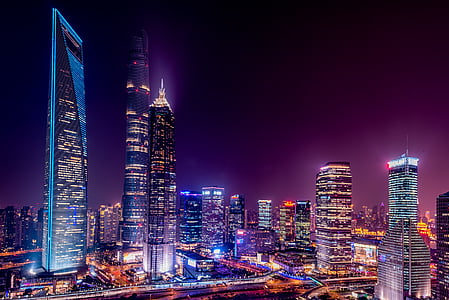 high-rise building lights turned-on during nighttime thumbnail