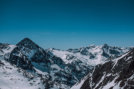 snowy mountain during day time thumbnail