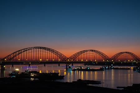black truss bridge over river thumbnail
