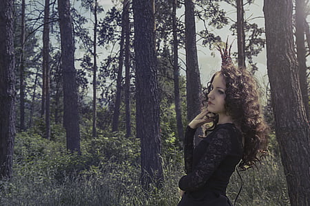woman standing near forest thumbnail