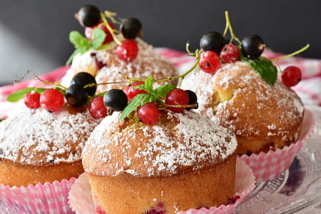 four baked cupcakes with cherries thumbnail