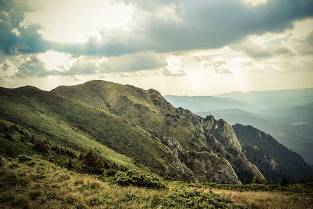 mountains under cloudy sky thumbnail
