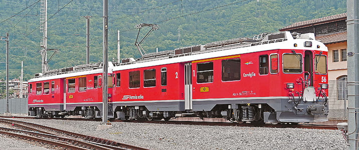red and white train on rail thumbnail