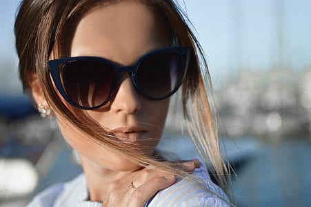 woman wearing black eyeglasses during daytime thumbnail