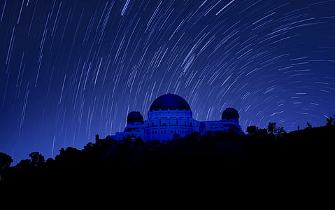 long exposure photography of mosque at night with stars thumbnail