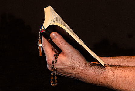 person holding a bible thumbnail