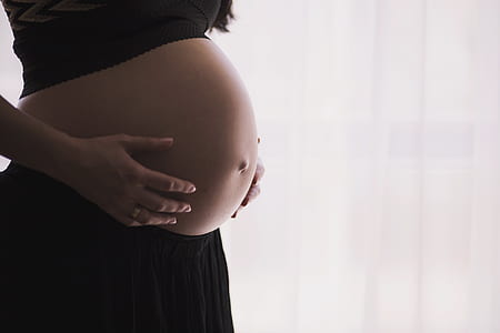 pregnant woman in black dress thumbnail