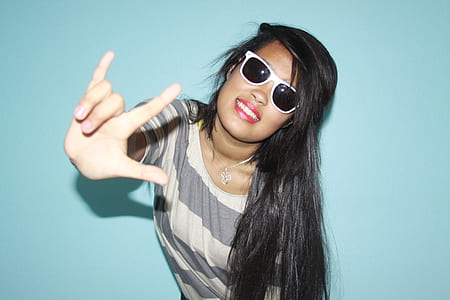 woman wearing gray striped top thumbnail