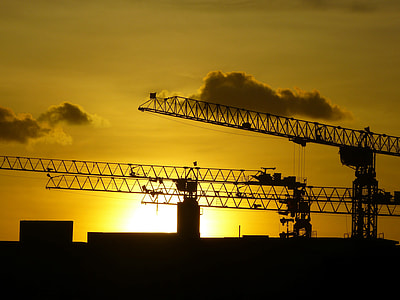 silhouette photography of machine during golden hour thumbnail