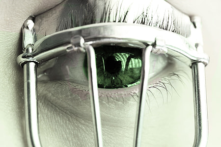 person using eyelash curler thumbnail