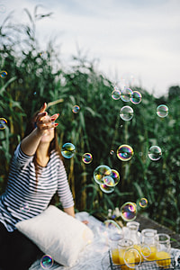 Having fun with soap bubbles in the nature thumbnail