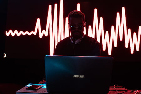 man playing black Asus laptop thumbnail