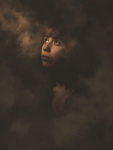 woman surrounded with smoke thumbnail