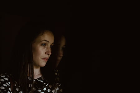 Woman Wearing Black and White Polka-dot Shirt thumbnail