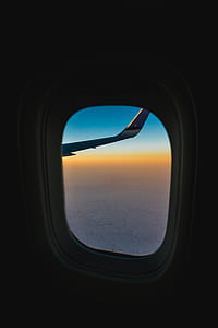 airplane window overlooking golden hour sight thumbnail